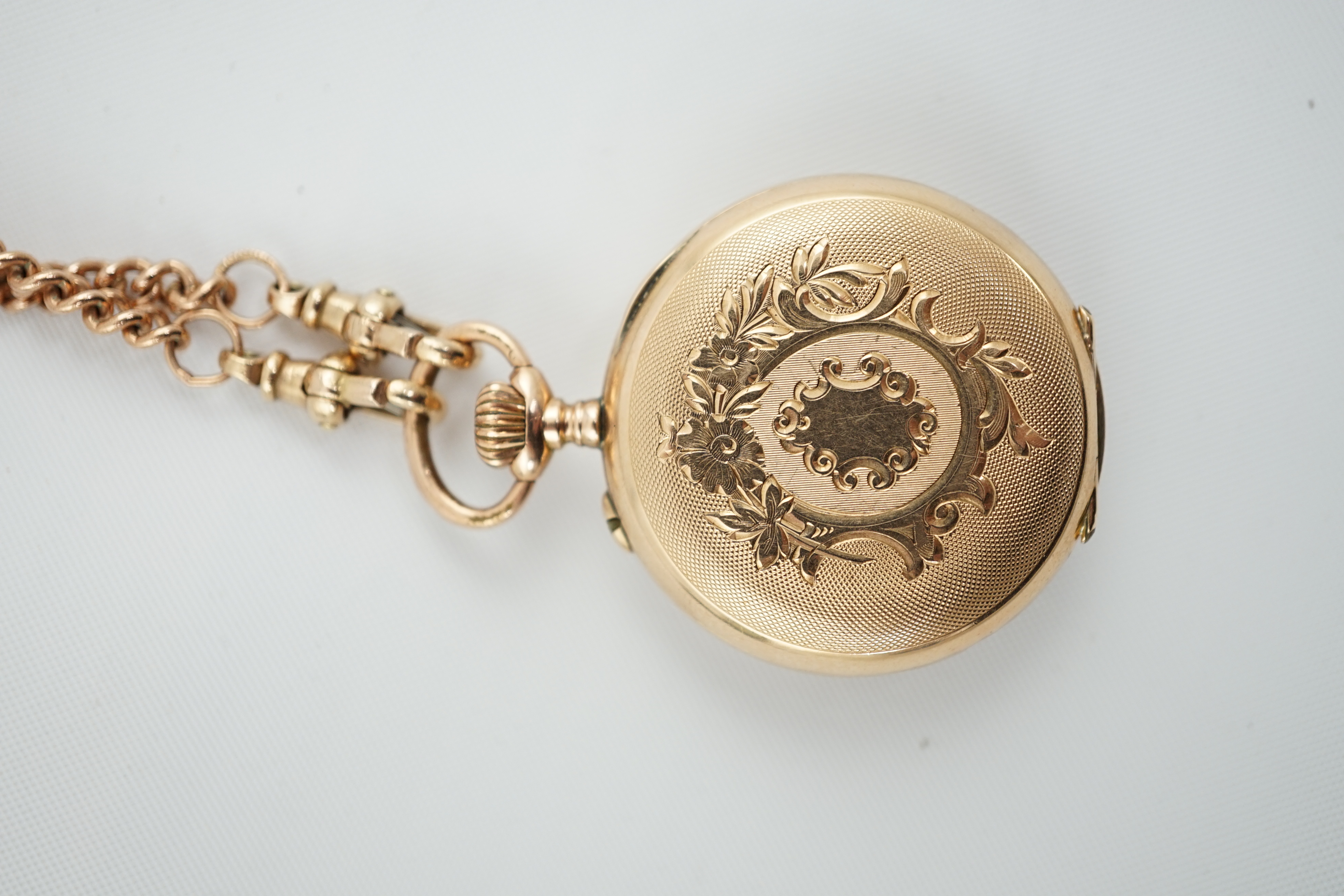 A Swiss 14k gold keyless open face fob watch